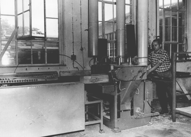 A man working on a machine in the factory